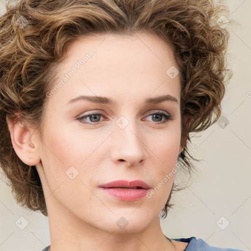 Neutral white young-adult female with medium  brown hair and green eyes