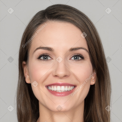 Joyful white young-adult female with long  brown hair and grey eyes