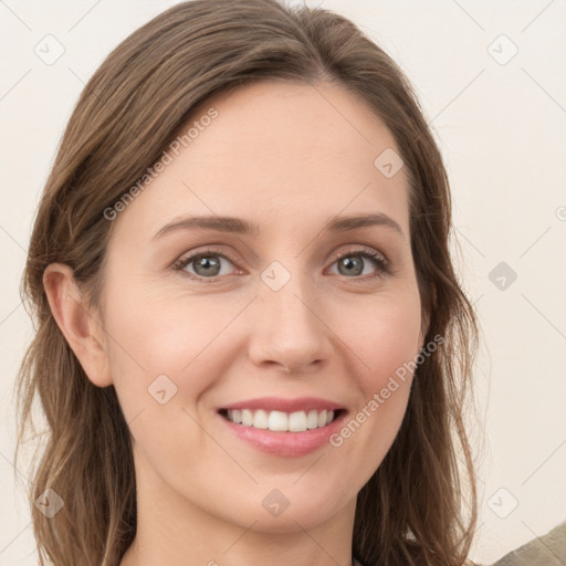 Joyful white young-adult female with long  brown hair and green eyes