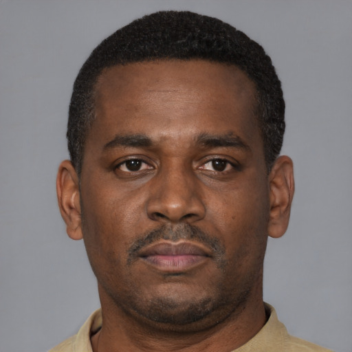 Neutral black young-adult male with short  brown hair and brown eyes