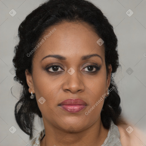 Joyful black adult female with medium  brown hair and brown eyes