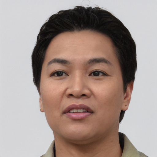 Joyful asian young-adult female with short  black hair and brown eyes