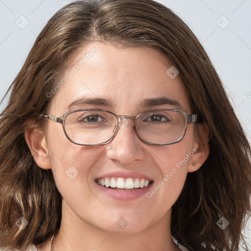 Joyful white adult female with long  brown hair and grey eyes