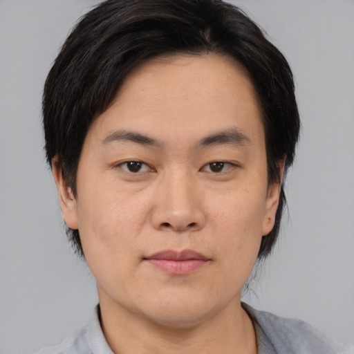 Neutral asian young-adult male with medium  black hair and brown eyes