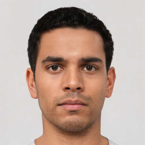 Neutral latino young-adult male with short  black hair and brown eyes