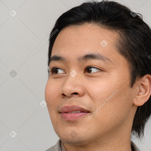 Joyful asian young-adult male with short  brown hair and brown eyes