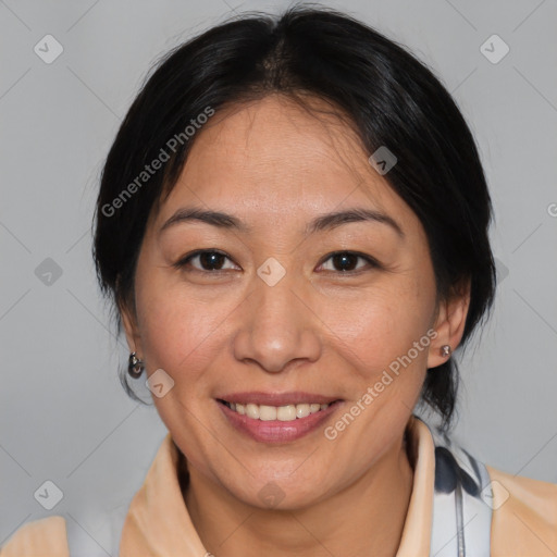 Joyful asian adult female with medium  brown hair and brown eyes