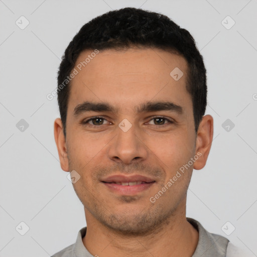 Joyful latino young-adult male with short  black hair and brown eyes