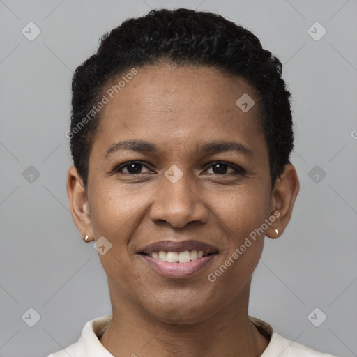 Joyful black young-adult female with short  black hair and brown eyes