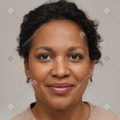 Joyful black adult female with short  brown hair and brown eyes