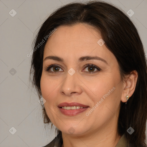 Joyful white adult female with medium  brown hair and brown eyes