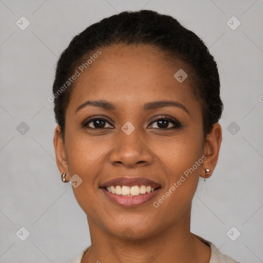 Joyful black young-adult female with short  brown hair and brown eyes