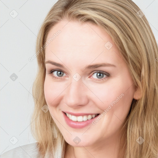 Joyful white young-adult female with long  brown hair and blue eyes