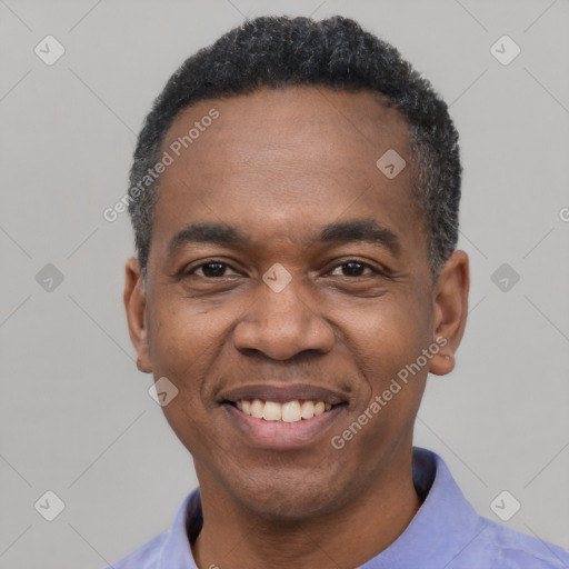 Joyful latino adult male with short  black hair and brown eyes