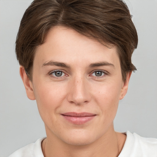 Joyful white young-adult female with short  brown hair and brown eyes