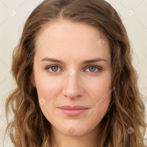 Joyful white young-adult female with long  brown hair and green eyes