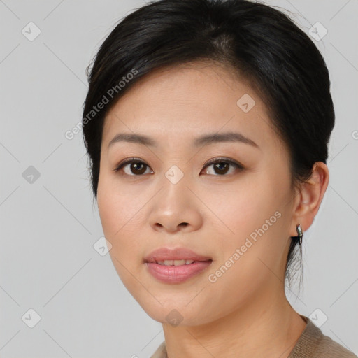 Joyful asian young-adult female with medium  black hair and brown eyes