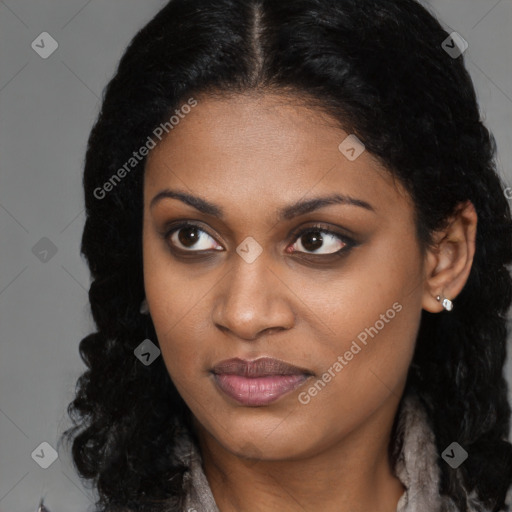 Joyful black young-adult female with long  brown hair and brown eyes