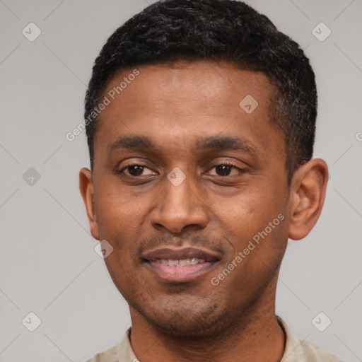 Joyful latino young-adult male with short  black hair and brown eyes
