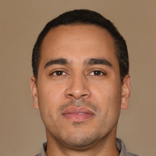 Neutral latino young-adult male with short  brown hair and brown eyes