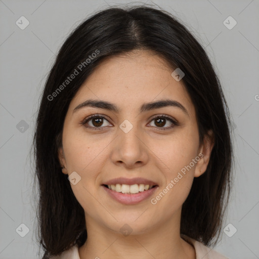 Joyful latino young-adult female with long  brown hair and brown eyes