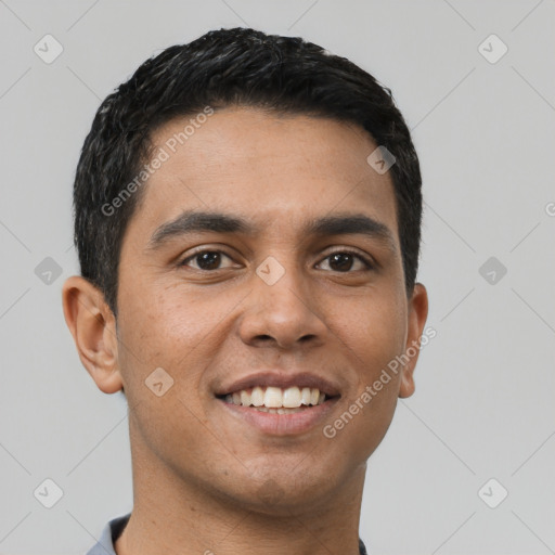 Joyful white young-adult male with short  black hair and brown eyes