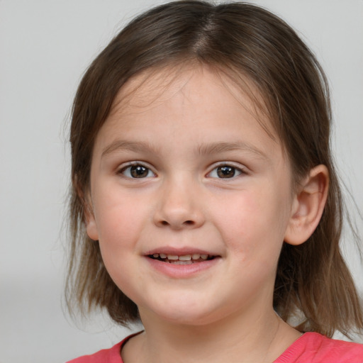 Joyful white child female with medium  brown hair and brown eyes