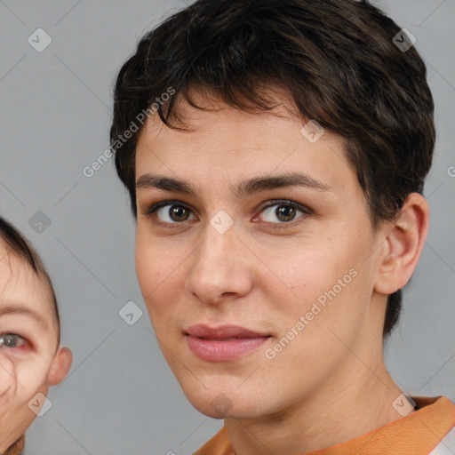 Joyful white young-adult female with short  brown hair and brown eyes