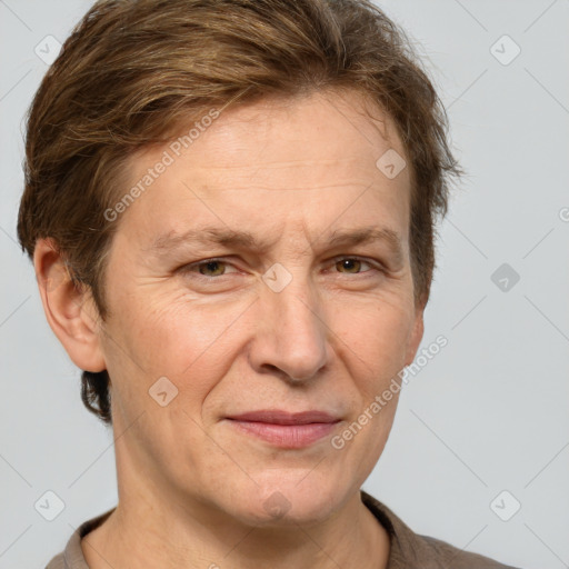 Joyful white adult female with short  brown hair and grey eyes