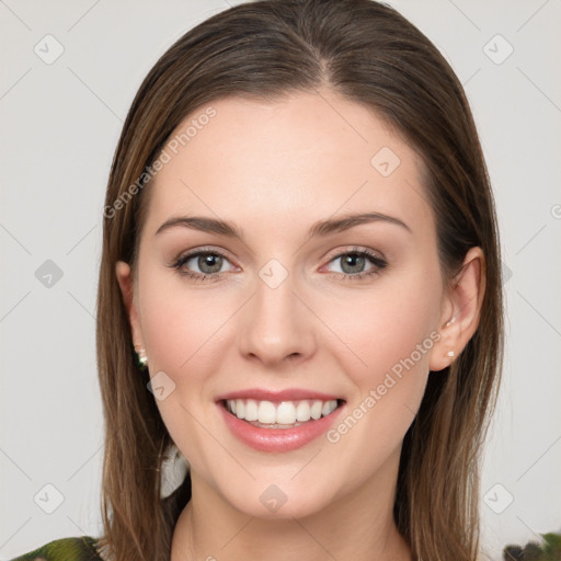 Joyful white young-adult female with long  brown hair and green eyes