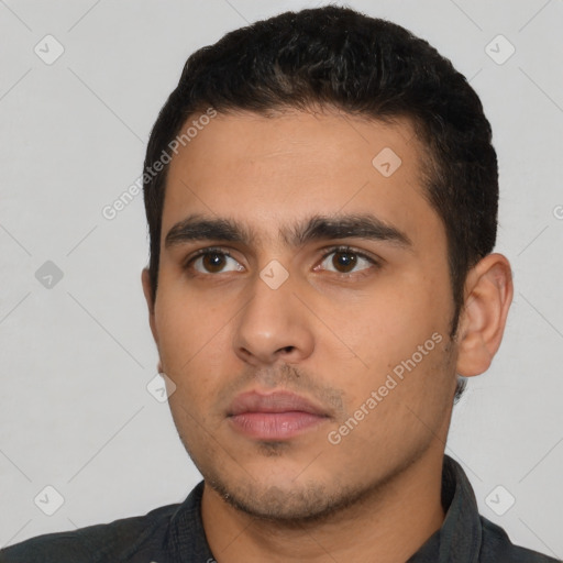 Neutral latino young-adult male with short  black hair and brown eyes