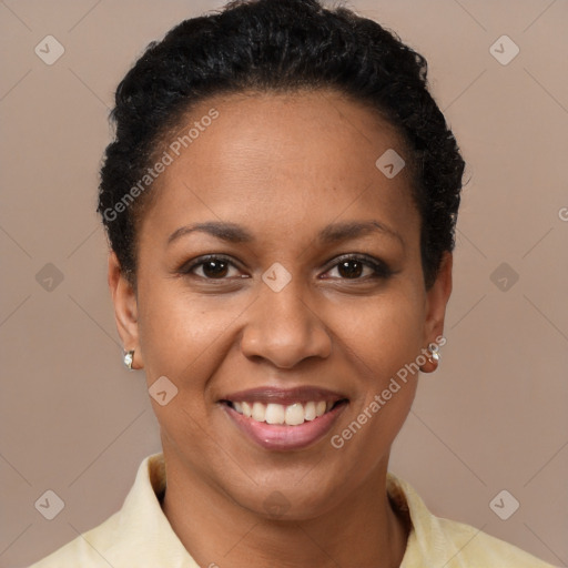 Joyful black young-adult female with short  brown hair and brown eyes