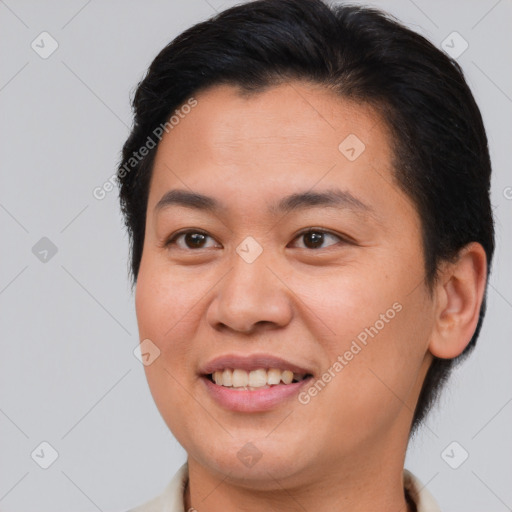 Joyful asian young-adult female with short  brown hair and brown eyes