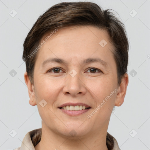 Joyful white adult female with short  brown hair and brown eyes