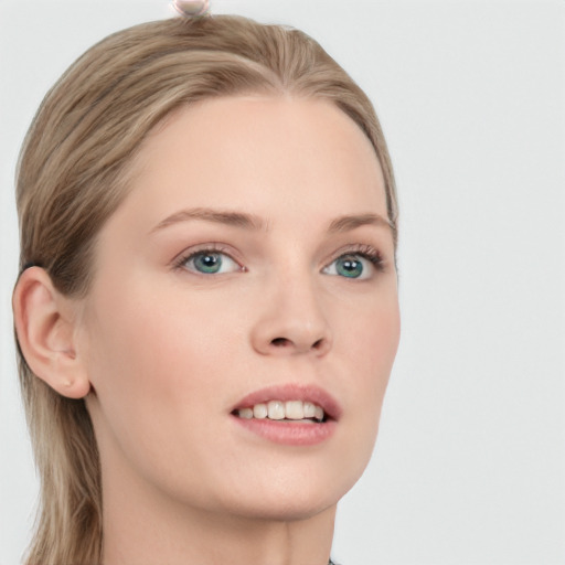 Joyful white young-adult female with long  brown hair and blue eyes