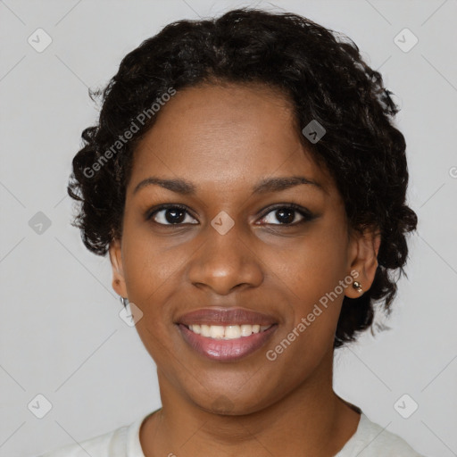 Joyful black young-adult female with short  black hair and brown eyes