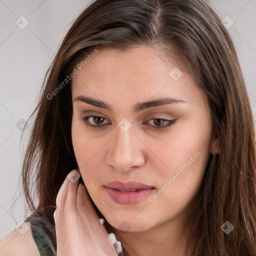 Neutral white young-adult female with long  brown hair and brown eyes