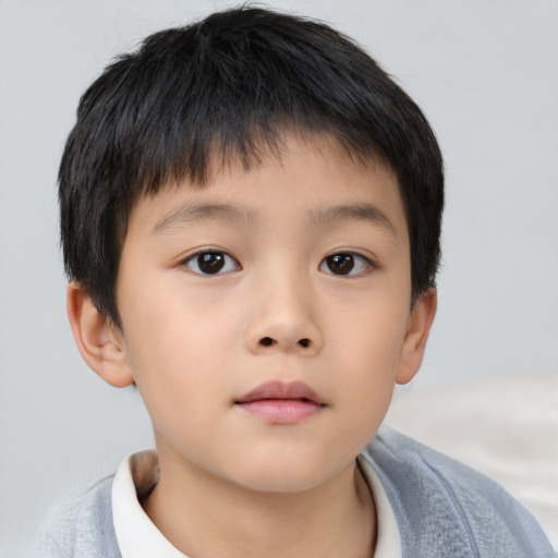 Neutral asian child male with short  brown hair and brown eyes