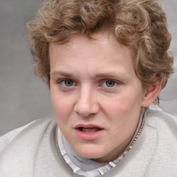 Joyful white young-adult male with short  brown hair and blue eyes