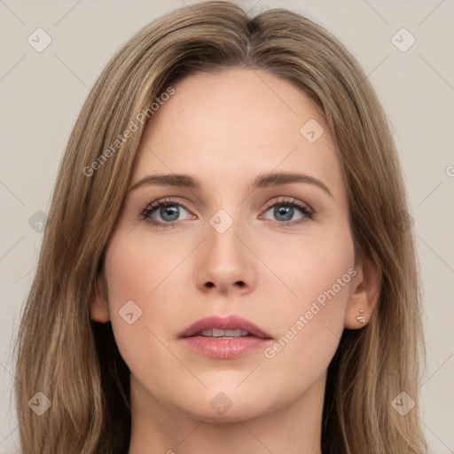 Neutral white young-adult female with long  brown hair and green eyes