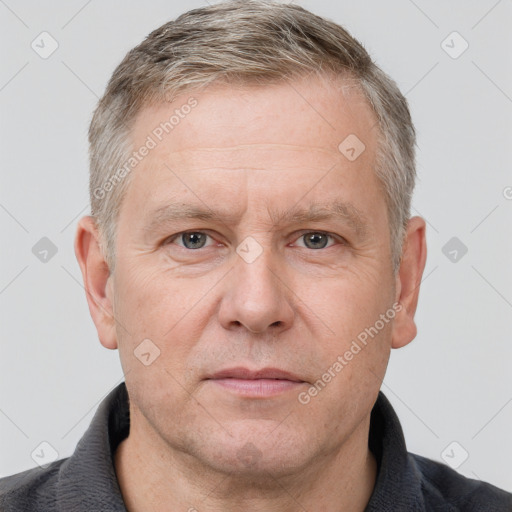 Neutral white adult male with short  brown hair and grey eyes