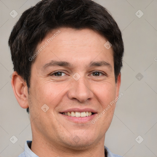 Joyful white adult male with short  brown hair and brown eyes