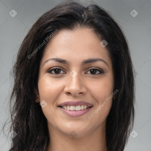 Joyful latino young-adult female with long  brown hair and brown eyes