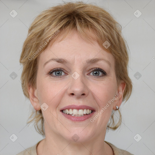 Joyful white young-adult female with medium  brown hair and blue eyes