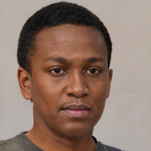 Neutral black young-adult male with short  brown hair and brown eyes