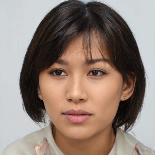 Neutral asian young-adult female with medium  brown hair and brown eyes