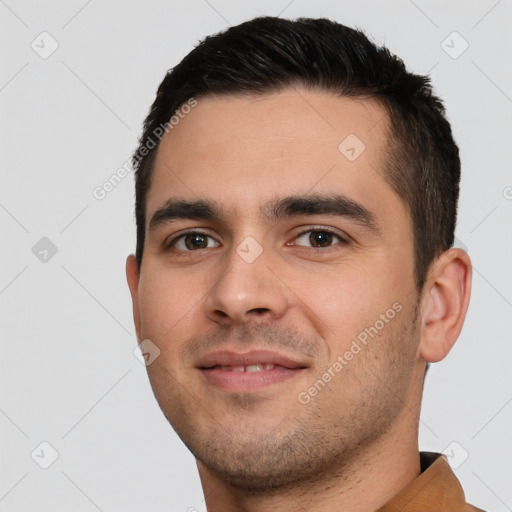 Joyful white young-adult male with short  brown hair and brown eyes