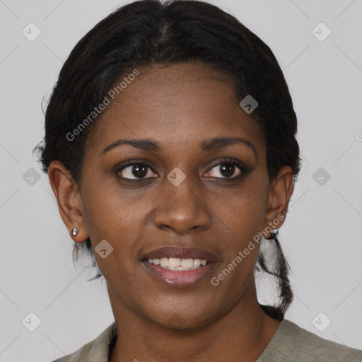 Joyful black young-adult female with short  black hair and brown eyes