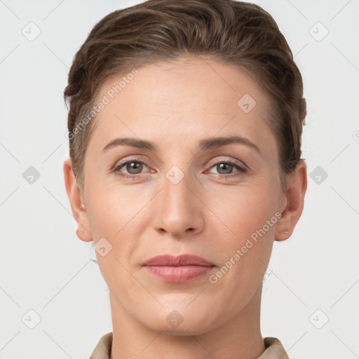 Joyful white young-adult female with short  brown hair and grey eyes