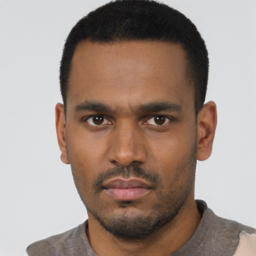Neutral black young-adult male with short  black hair and brown eyes